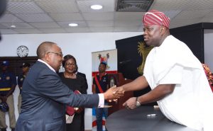 Lagos State Governor, Mr. Akinwunmi Ambode (right), congratulating the Chairman, Board of Neighbourhood Safety Corp Agency, DIG Israel Ajao (rtd.) during the inauguration of the Board at the Conference Room, Lagos House, Ikeja, on Wednesday, November 23, 2016. With them is Director, Legislative Drafting, Ministry of Justice, Mrs. Yejide Kolawole. 